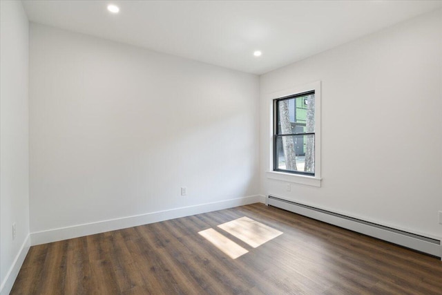 676 Sebago Rd, Sebago, ME 04029 - empty room with wood finished floors, recessed lighting, baseboards, and a baseboard heating unit