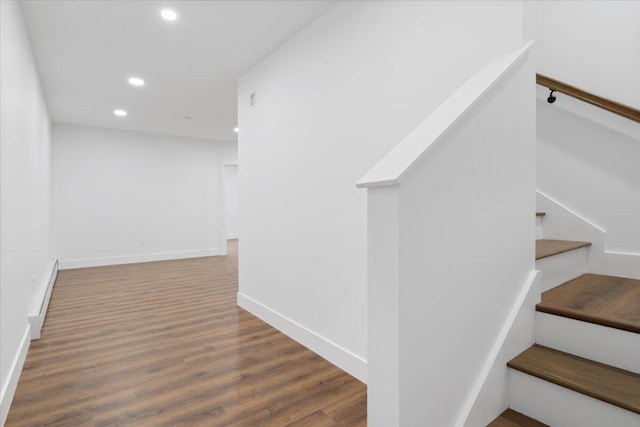 676 Sebago Rd, Sebago, ME 04029 - stairs with recessed lighting, baseboards, a baseboard heating unit, and wood finished floors