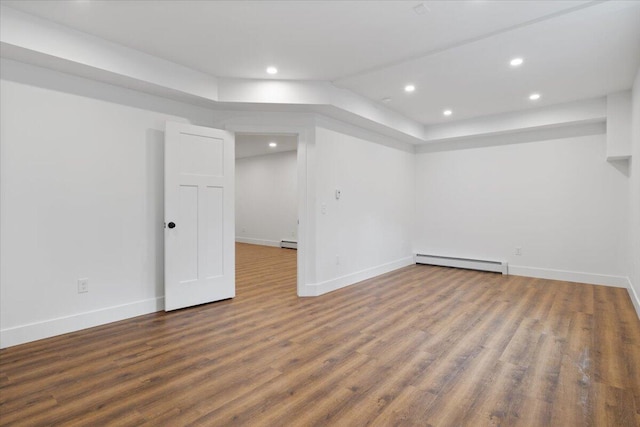 676 Sebago Rd, Sebago, ME 04029 - finished below grade area with recessed lighting, a baseboard radiator, baseboards, and wood finished floors