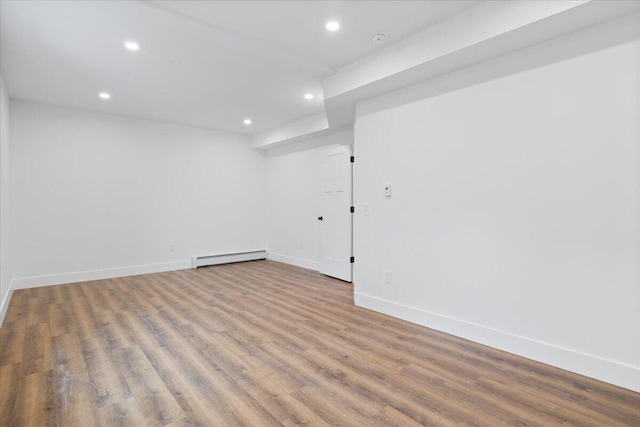 676 Sebago Rd, Sebago, ME 04029 - finished below grade area featuring recessed lighting, baseboards, a baseboard heating unit, and wood finished floors