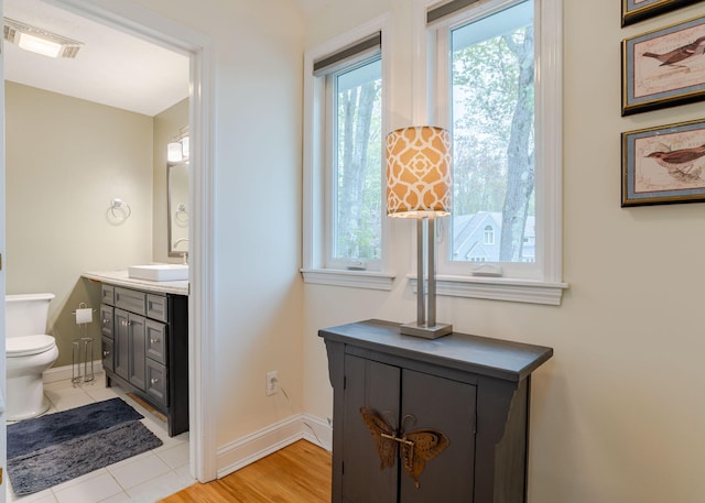 135 Portland Ave Unit 803, Old Orchard Beach, ME 04064 - bathroom with toilet, vanity, baseboards, and tile patterned flooring