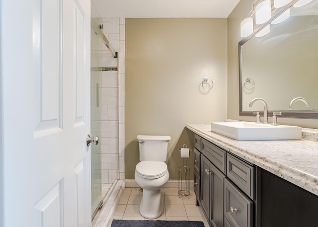 135 Portland Ave Unit 803, Old Orchard Beach, ME 04064 - bathroom featuring tile patterned floors, toilet, vanity, and a tile shower