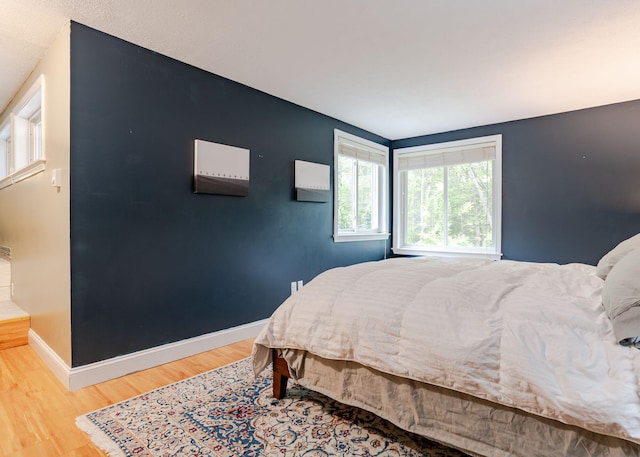 135 Portland Ave Unit 803, Old Orchard Beach, ME 04064 - bedroom featuring wood finished floors and baseboards