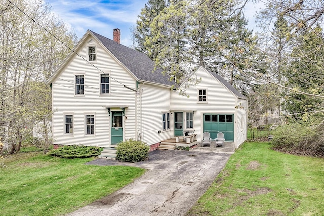 8 Park St, Camden, ME 04843 - traditional home featuring a front yard, driveway, a chimney, and a shingled roof