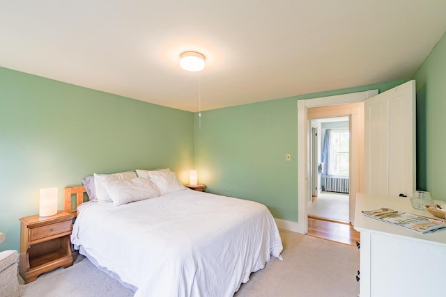 8 Park St, Camden, ME 04843 - bedroom featuring radiator heating unit, light colored carpet, and baseboards
