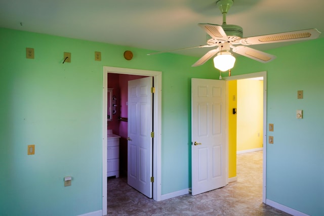 unfurnished bedroom with baseboards and a ceiling fan