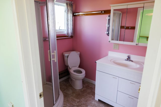 full bath with vanity, a shower stall, toilet, baseboards, and tile patterned flooring