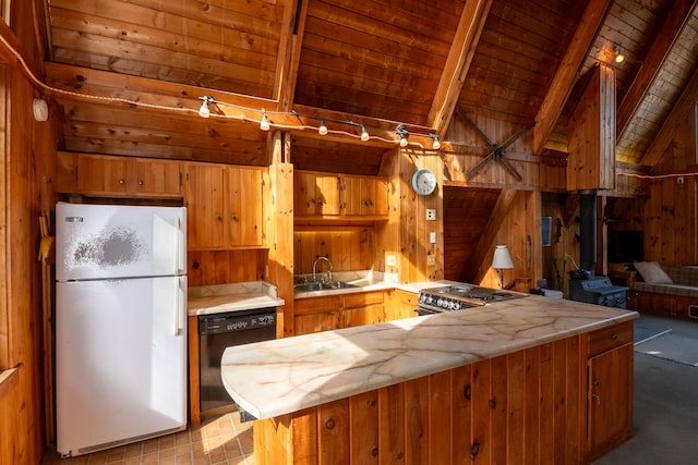 kitchen with wood ceiling, dishwasher, beamed ceiling, freestanding refrigerator, and wooden walls