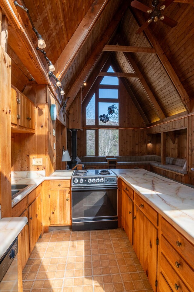 kitchen featuring wood walls, black electric range oven, light countertops, wood ceiling, and lofted ceiling with beams