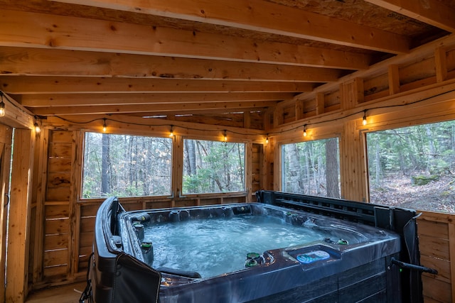 sunroom / solarium featuring a hot tub and plenty of natural light