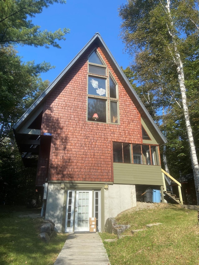 rear view of house with a lawn