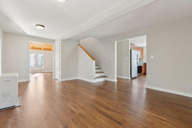 27 Rein Rd, Saint George, ME 04859 - unfurnished living room featuring stairway, baseboards, and dark wood-style floors