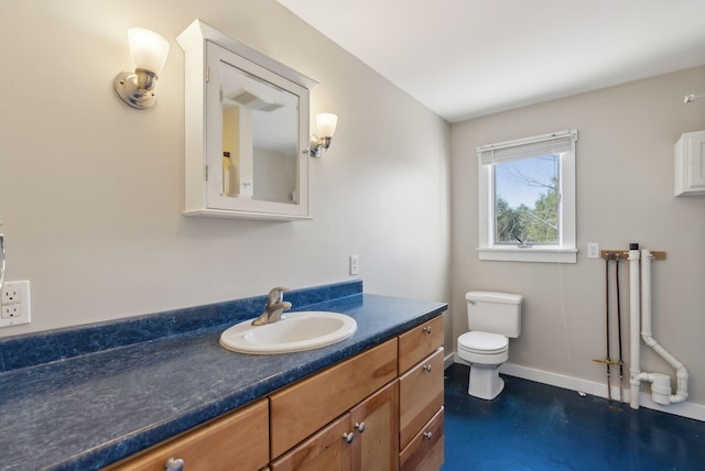 27 Rein Rd, Saint George, ME 04859 - bathroom with toilet, baseboards, concrete floors, and vanity