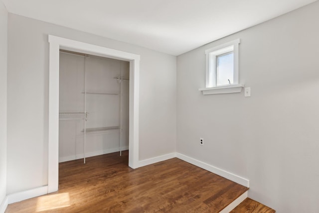 27 Rein Rd, Saint George, ME 04859 - unfurnished bedroom featuring a closet, baseboards, and wood finished floors