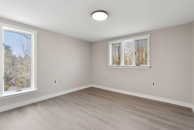27 Rein Rd, Saint George, ME 04859 - unfurnished room with baseboards, a healthy amount of sunlight, and wood finished floors
