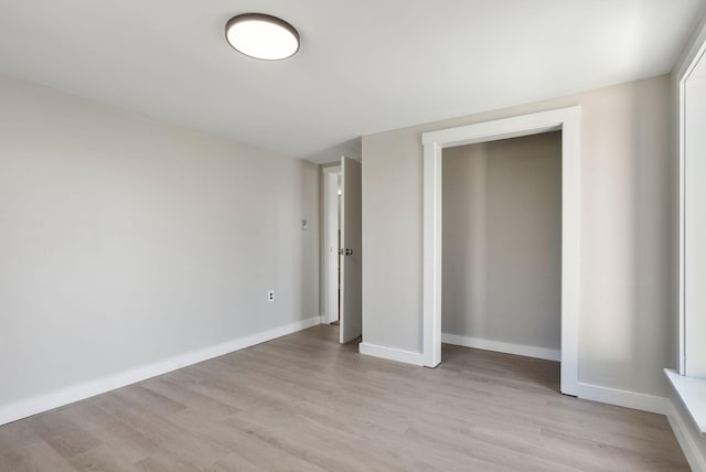 27 Rein Rd, Saint George, ME 04859 - unfurnished bedroom with light wood-style floors, baseboards, and a closet