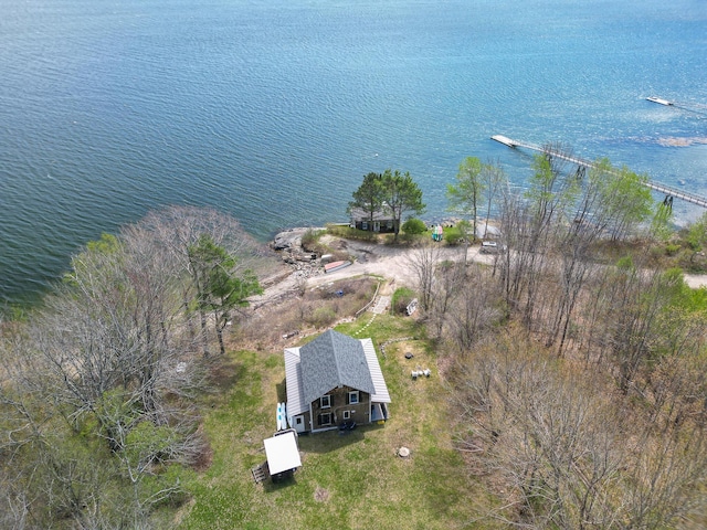 aerial view of property and surrounding area featuring a nearby body of water