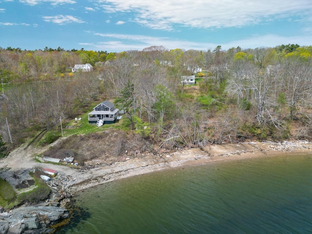 aerial view of property's location with a heavily wooded area