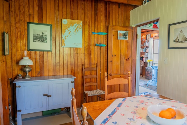 bedroom featuring wooden walls