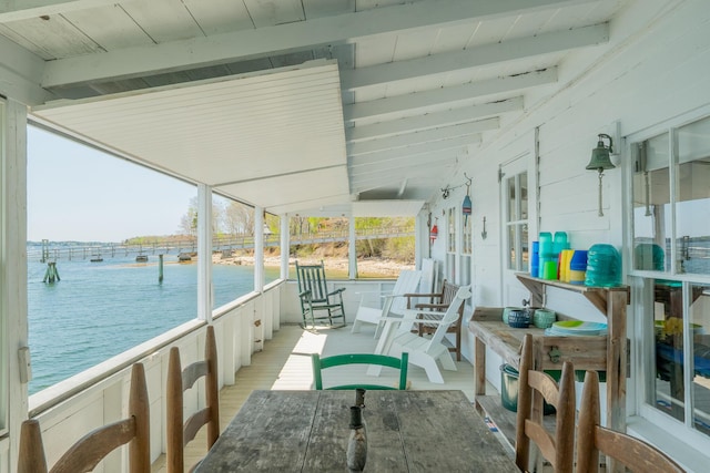 view of patio / terrace featuring a water view and covered porch