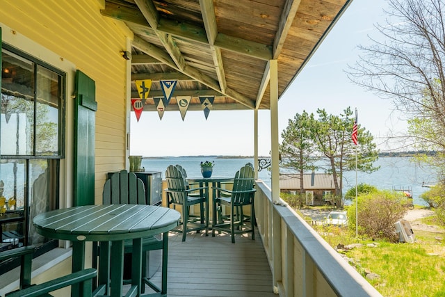 wooden deck with a water view