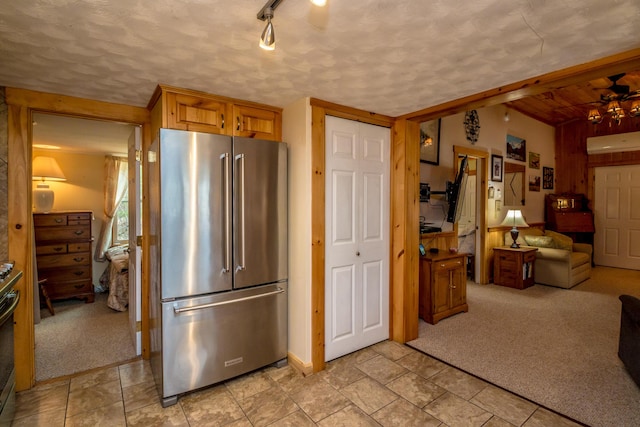 33 Rennie Ln, Brownfield, ME 04010 - kitchen with appliances with stainless steel finishes, light carpet, rail lighting, and open floor plan