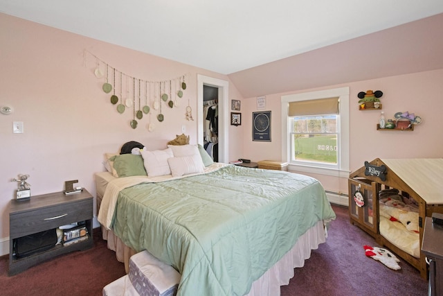 bedroom with a baseboard radiator, lofted ceiling, and dark colored carpet