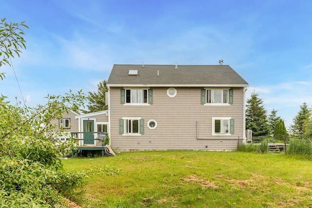 361 Sedgwick Ridge Rd, Sedgwick, ME 04676 - rear view of property featuring a wooden deck, a yard, and roof with shingles