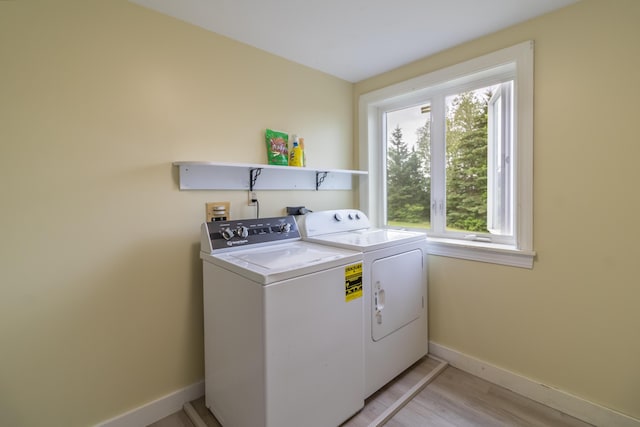 361 Sedgwick Ridge Rd, Sedgwick, ME 04676 - laundry room with independent washer and dryer, healthy amount of natural light, and light wood-type flooring