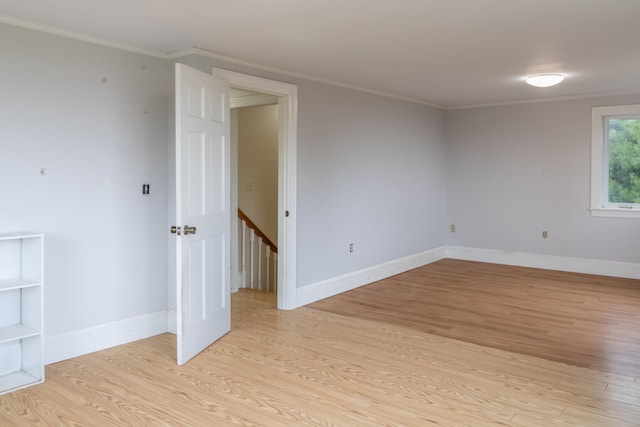 361 Sedgwick Ridge Rd, Sedgwick, ME 04676 - empty room featuring light wood-style flooring and ornamental molding