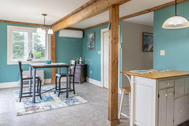 361 Sedgwick Ridge Rd, Sedgwick, ME 04676 - dining space featuring a wall unit AC and ornamental molding