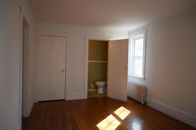 104 Northern Ave, Gardiner, ME 04345 - unfurnished bedroom featuring wood finished floors, ornamental molding, baseboards, and radiator heating unit
