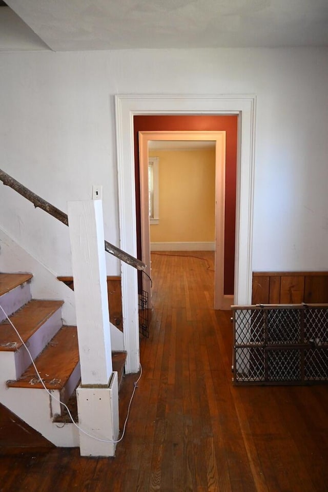 104 Northern Ave, Gardiner, ME 04345 - corridor featuring stairs and hardwood / wood-style flooring