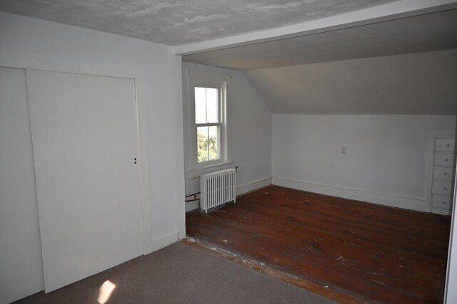 104 Northern Ave, Gardiner, ME 04345 - additional living space featuring radiator, baseboards, wood-type flooring, and vaulted ceiling