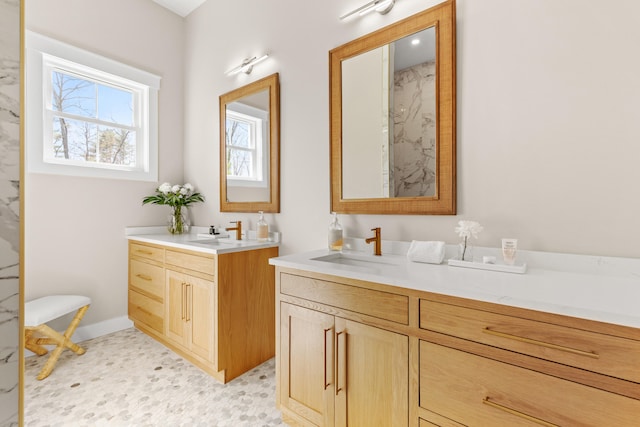 full bathroom featuring two vanities