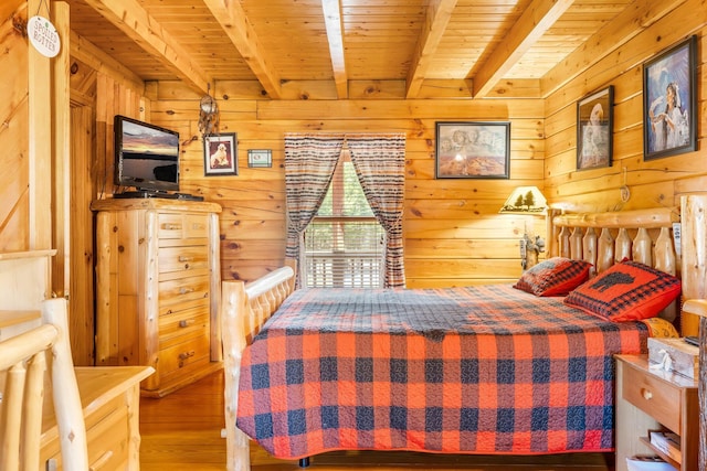 291 River Rd, Milo, ME 04463 - bedroom featuring wooden ceiling, wood walls, wood finished floors, and beamed ceiling