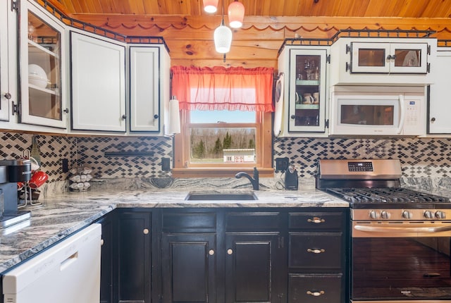 291 River Rd, Milo, ME 04463 - kitchen with white appliances, wood ceiling, tasteful backsplash, and a sink