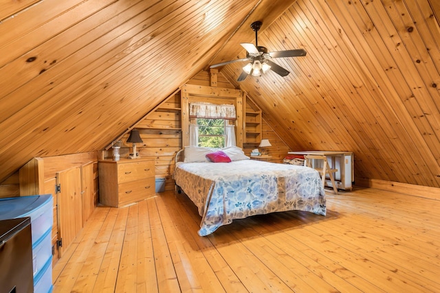 291 River Rd, Milo, ME 04463 - bedroom featuring lofted ceiling, wooden walls, and light wood finished floors