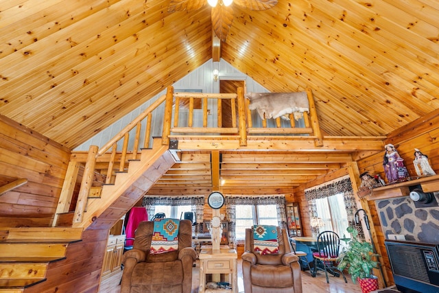 291 River Rd, Milo, ME 04463 - living area with wooden walls, high vaulted ceiling, and wooden ceiling