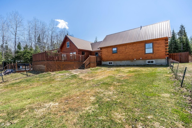 291 River Rd, Milo, ME 04463 - back of property featuring fence, log exterior, a lawn, and a deck