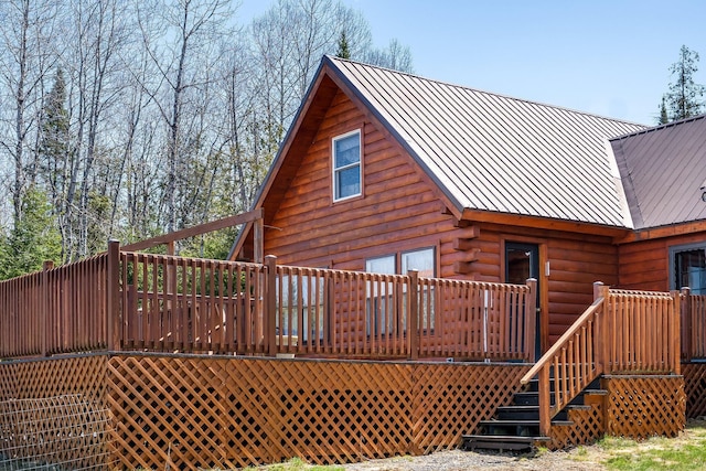 291 River Rd, Milo, ME 04463 - rear view of house featuring a deck, metal roof, and log exterior