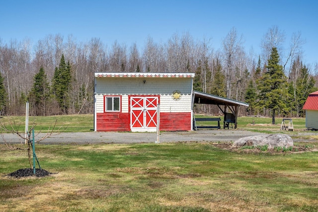 291 River Rd, Milo, ME 04463 - view of outdoor structure featuring an outbuilding and a carport