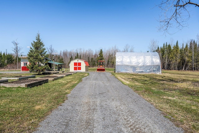 291 River Rd, Milo, ME 04463 - view of street featuring driveway and an exterior structure