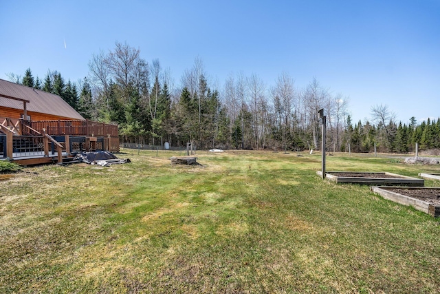 291 River Rd, Milo, ME 04463 - view of yard with a wooden deck, a garden, and fence