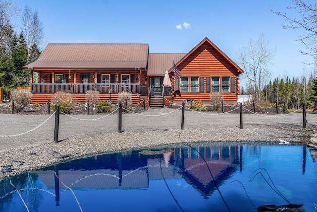 291 River Rd, Milo, ME 04463 - back of property featuring metal roof and log exterior