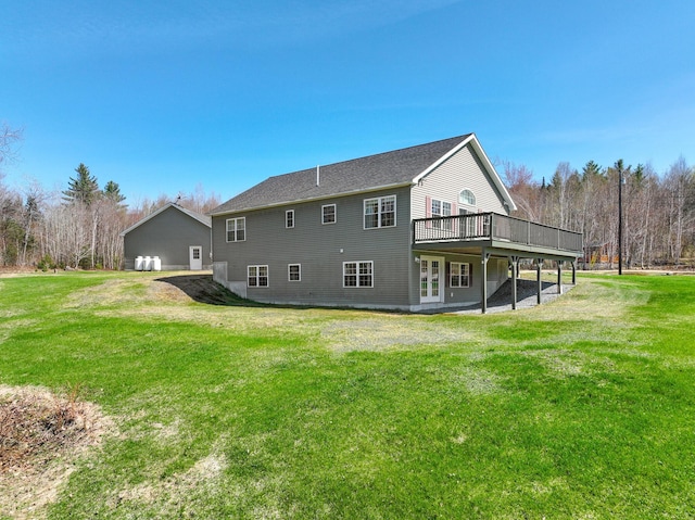 back of house featuring french doors, a yard, and a deck