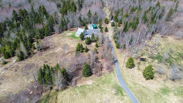 aerial view featuring a wooded view