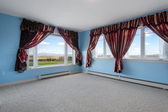 unfurnished room with carpet flooring, baseboards, and baseboard heating