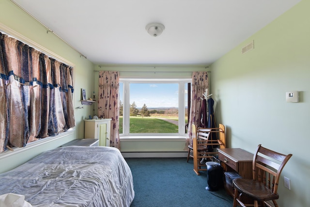 carpeted bedroom featuring visible vents and baseboard heating
