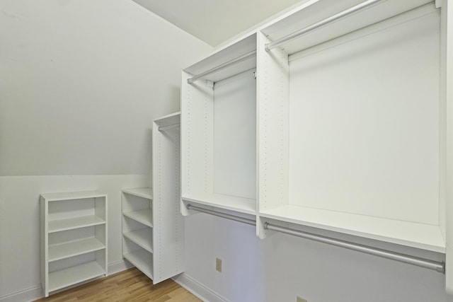 walk in closet featuring light wood-style flooring